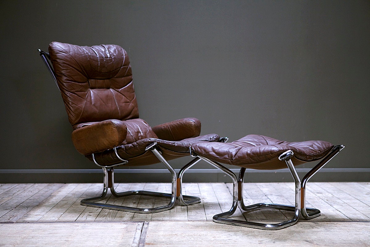 A 1970's Westnofa Wing Chair and foot stool by Harald Relling.