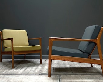 SOLD. A pair of USA 75 Armchairs by Folke Ohlsson for Dux, 1950s (reupholstered to specification).