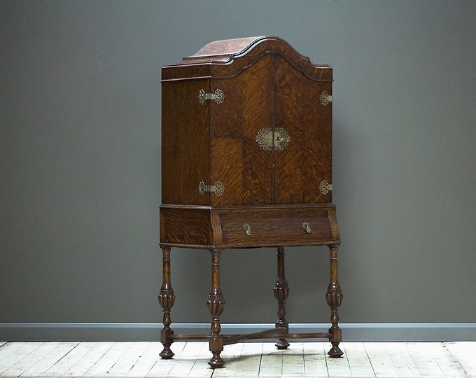 An early 1900's cocktail cabinet in oak.
