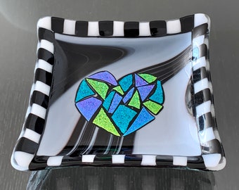 Fused glass dish in black and white with dichroic heart