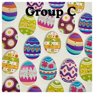 May include: Group C of colorful wooden Easter egg ornaments with various patterns and designs. The eggs are arranged in a circular pattern on a white background.