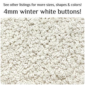 May include: A large collection of small, round, winter white buttons, each measuring 4mm in diameter and featuring two holes in the center. The text at the top reads: See other listings for more sizes, shapes & colors! 4mm winter white buttons!