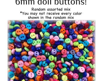 May include: A large collection of 6mm doll buttons in a random assorted mix of colors including red, orange, yellow, green, blue, purple, pink, and white. Each small circular button features two holes in the center for sewing attachment.