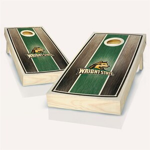 May include: A set of two wooden cornhole boards with a green and black striped design. The boards feature the Wright State University logo with a wolf mascot and the text "Wright State".