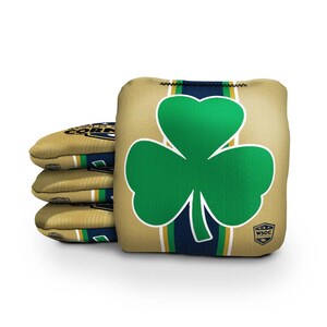 May include: Four gold bean bags with a green shamrock design and the text "WSOC OFFICIAL" on the front. The bean bags are stacked on top of each other.