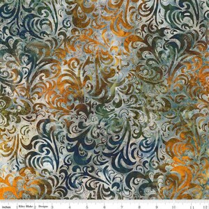 May include: A fabric with a swirling, ornate pattern in shades of blue, orange, brown, and green. The design features a repeating motif of stylized, curved lines and flourishes, creating a textured, artistic look. The fabric is measured in inches.