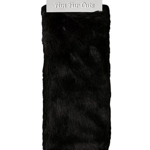 May include: A rectangular piece of black faux fur with a soft, textured appearance. The product is packaged with a white header card that reads "Fun Fur Cuts". The fur appears to be a solid, dark color.