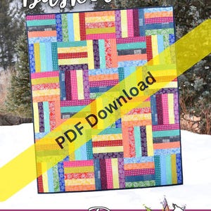 Pode incluir: Uma colcha com um padrão de patchwork multicolorido de tiras de tecido retangulares em tons de vermelho, laranja, amarelo, verde, azul e roxo. O texto "Basket Case" e "PDF Download" aparecem na colcha, com "Running Doe Quilts" abaixo.