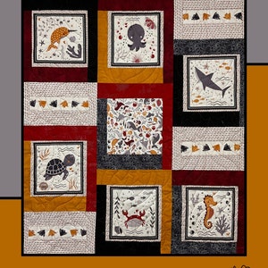 May include: A quilt pattern featuring a variety of sea creatures, including a crab, octopus, shark, turtle, and seahorse. The quilt is made up of nine squares, each with a different design. The quilt is in a red, black, and white color scheme. The text "Crab Cakes" is at the top of the image. The text "Heidi Cook for Villa Rosa Designs" is at the bottom of the image.