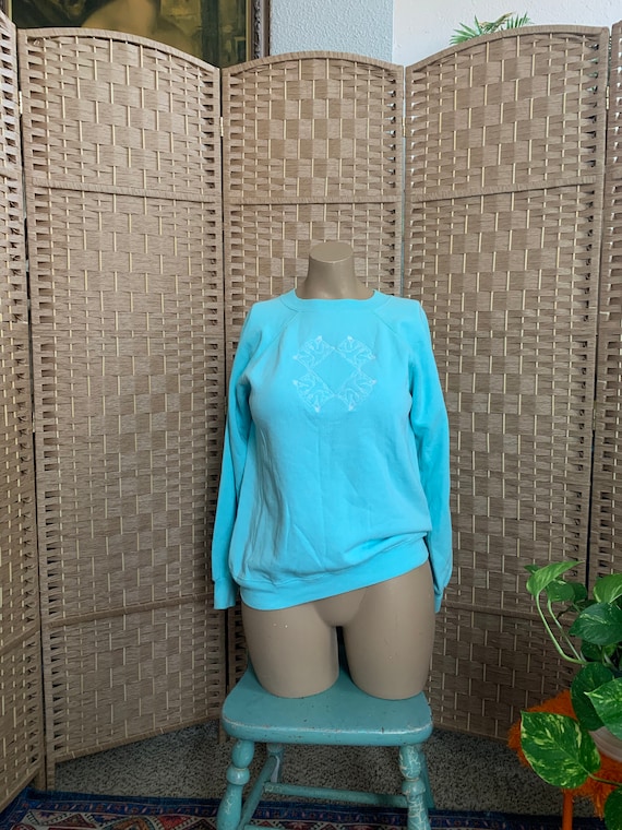 VTG Turquoise Embroidered Nudes Sweatshirt . Hanes