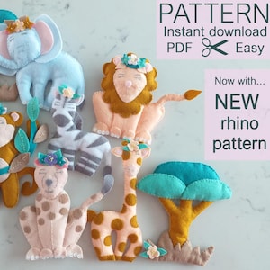 May include: A collection of handmade felt animal patterns, including an elephant, lion, zebra, giraffe, and cheetah, each adorned with floral accents. The image also features a felt tree and text that reads "PATTERN" and "NEW rhino pattern".