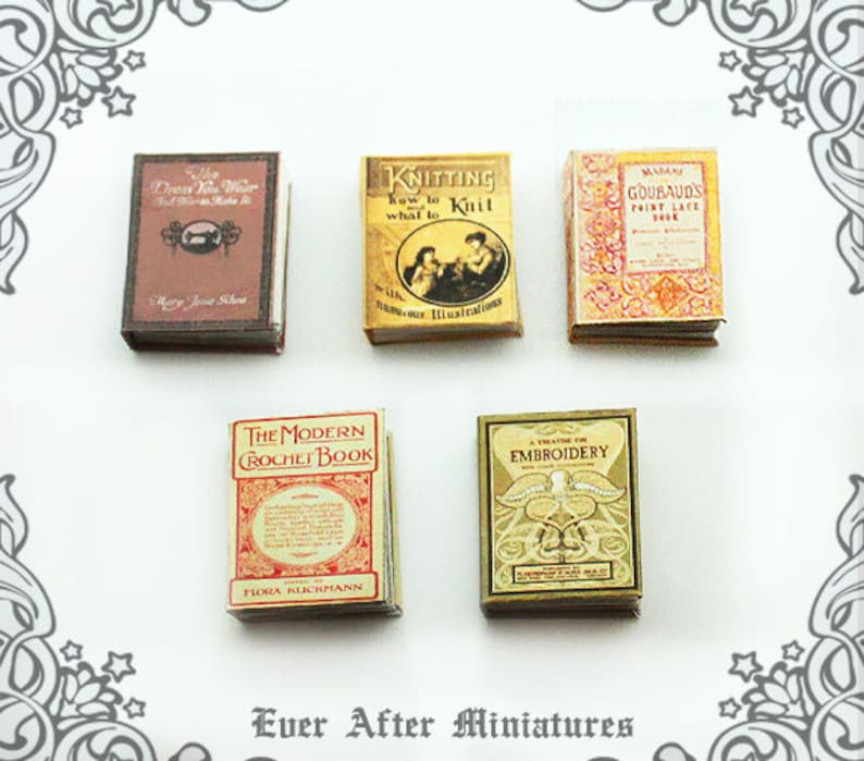 May include: A collection of miniature vintage books with titles like "The Modern Crochet Book", "Knitting How to Knit What to", "A Treatise on Embroidery", "Goubaud's Point Lace Book", and "The Dress You Wear".