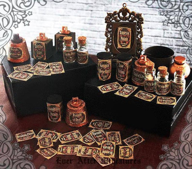 May include: A collection of small glass bottles with cork stoppers and labels that read "Amnesia Potion", "Vampire Repellant", "Love Potion", "Truth of Life", "Morning Potion", and "Draught of Death". The bottles are arranged on a wooden surface with a decorative frame and other potion bottles.