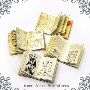 May include: Set of five miniature books with vintage-style covers and pages featuring illustrations of symbols, text, and a drawing of a demon. The books are titled "Chapter Six" and "Chapter Six", and the text on the pages is in a gothic font.