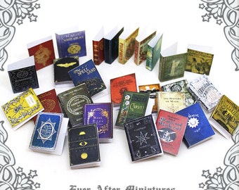 May include: A collection of miniature books with various titles, including "Magic White Spell Land", "Fortune-Telling", "The Handbook of Carsoma", "Curses", "The History of Magic", "Witchcraft", "Magic", and "Witches Dream Book".