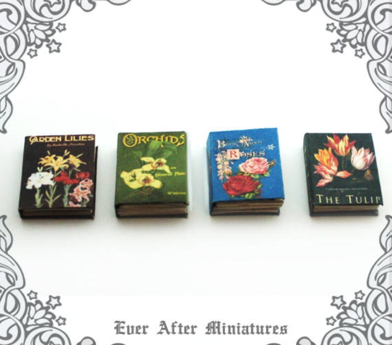 May include: Five miniature books with floral illustrations and titles. The books are "Garden Lilies", "Orchids", "Book of Roses", "The Tulip", and "The Tulip".