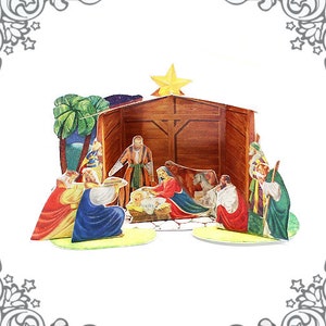 May include: A papercraft nativity scene with a wooden stable, a palm tree, and figures of Mary, Joseph, baby Jesus, and the three wise men.
