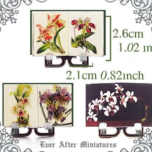 May include: Three miniature books with floral illustrations. The books are 2.1 inches wide and 0.82 inches tall. The covers feature orchids, a pink and white orchid, a purple orchid, and a white orchid.