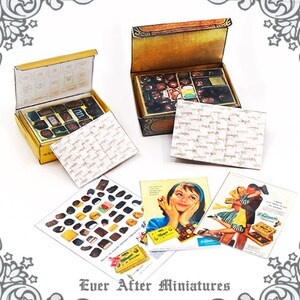 May include: Two miniature boxes of chocolates, one open and one closed, with a vintage design. The boxes are surrounded by miniature paper bags and magazine advertisements for chocolates.