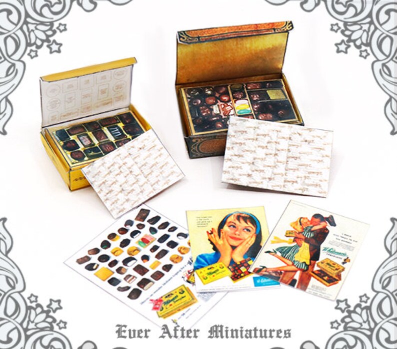 May include: Two miniature boxes of chocolates, one open and one closed, with a vintage design. The boxes are surrounded by miniature paper bags and magazine advertisements for chocolates.