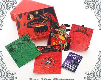 May include: A set of vintage Halloween party games, including a "Stunt Halloween Quiz", a "Whirl-O Halloween Fortune &  Sturt Game", a "Boys and Girls Here Your Fate" game, and a "Halloween" game with a skull and crossbones graphic.
