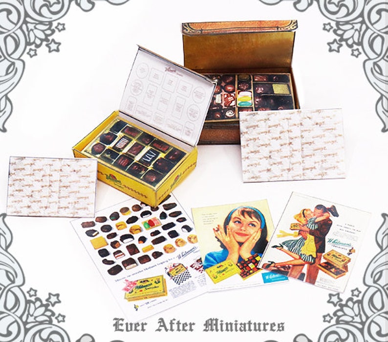 May include: A miniature dollhouse-sized chocolate box with an open lid, revealing a variety of chocolate candies. The box is decorated with the words "Whitman's Sampler" and a vintage-style design. The box is sitting on a table with several other miniature items, including a piece of paper with a list of chocolates and a vintage advertisement for Whitman's chocolates.