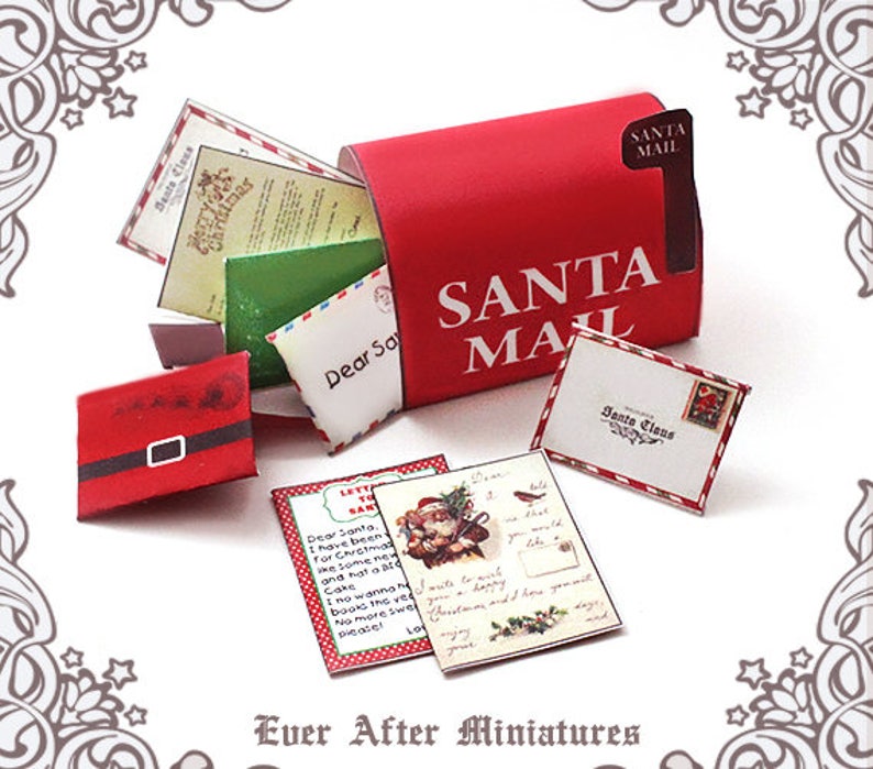 May include: A miniature red Santa Mailbox with the words "SANTA MAIL" in white. Several miniature letters and envelopes are spilling out, including one with "Dear Santa" written on it. A miniature Santa Claus belt is also present.