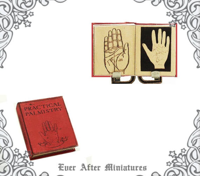 May include: A miniature red book titled "The Practical Palmistry" with a hand illustration on the cover.  The book is open to reveal two pages with hand illustrations and the text "The Practical Palmistry".
