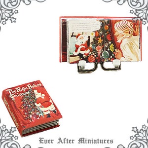 May include: A miniature red book titled "The Night Before Christmas" with a Santa Claus illustration on the cover. The book is displayed on a miniature book stand with a vintage Christmas scene.