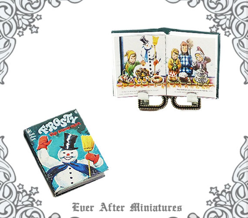 May include: A vintage book titled "Frosty the Snow Man" with a colorful illustration of Frosty on the cover. The book is next to a miniature open book with a green cover and illustrations of children making a snowman.