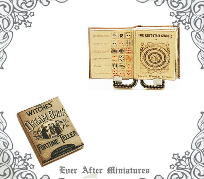 May include: A miniature book titled "The Witches Dream Book Fortune Teller" with a vintage design. The book is open to reveal a page with a list of items. The book is sitting on a miniature stand with a book titled "The Egyptian Circle; Ancient Wheel of Fortune".
