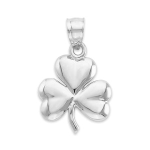 May include: A silver charm pendant in the shape of a three-leaf clover.