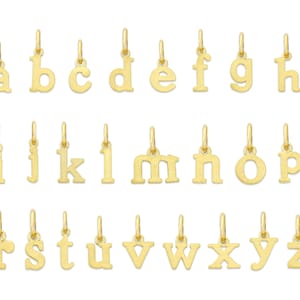 May include: Gold-toned alphabet letter charms, each letter is on a separate charm. The letters are in a simple, classic font. The charms are perfect for adding a personalized touch to jewelry.