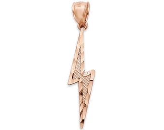 May include: A rose gold lightning bolt pendant with a textured surface. The pendant is suspended from a small loop at the top. The lightning bolt design is a popular symbol.