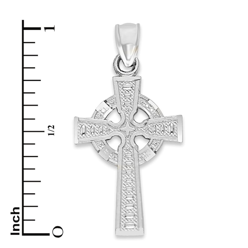 May include: Silver Celtic cross pendant with intricate detailing. The cross is approximately 1 inch in size.