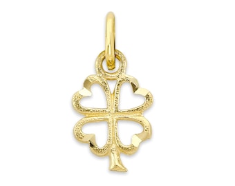 May include: A gold four-leaf clover charm pendant. The clover is made of a textured metal and has a delicate, openwork design.