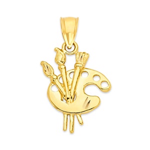 May include: A gold-toned pendant charm featuring a paint palette with three paintbrushes.