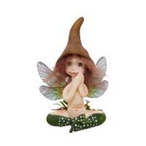 May include: A small, fairy figurine with brown hair, a brown pointed hat, and iridescent wings. The fairy is sitting with its hands clasped in front of its face and is wearing a green skirt with white dots.