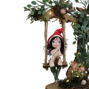 Forest fairy on swing. Elf cold porcelain decorative fairy figure, miniature fairy elf, fairy garden