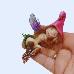 Forest fairy sleeping. Decorative porcelain cold porcelain fairy figure elf, elf fairy lying, little fairy, magical beings, fantasy, gnome.