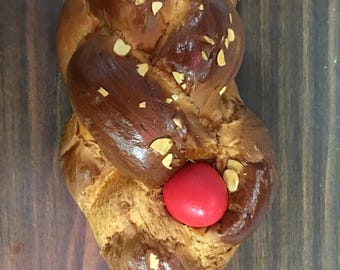 Greek Tsoureki bread with Egg. Greek Easter Bread, Challah bread loaf, vasilopita
