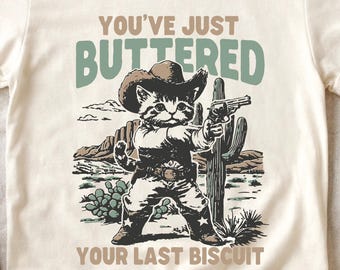 Funny Cat Shirt, You’ve Just Buttered Your Last Biscuit Tee, Cowboy Cat Apparel, Western Humor, Cat Lover Gift
