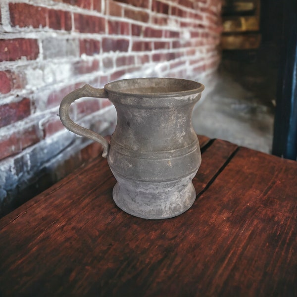 Old German pewter measuring jug