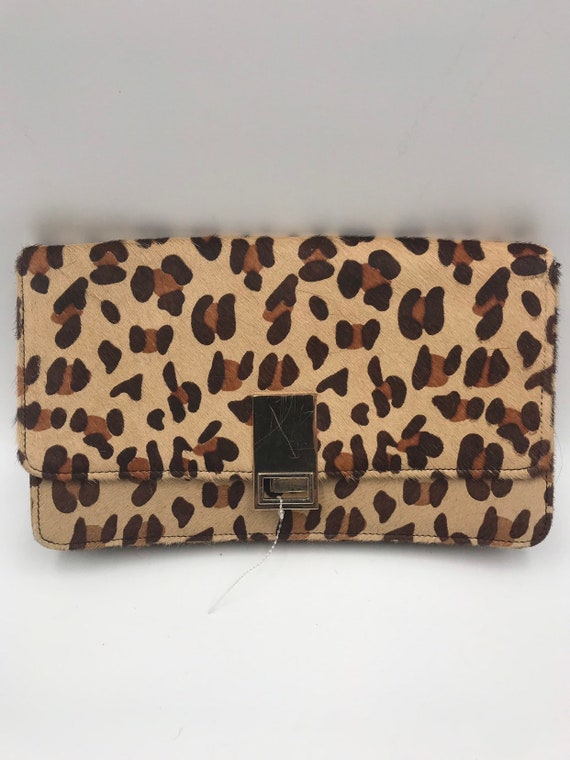 Cow natural fur leopard print clutch.