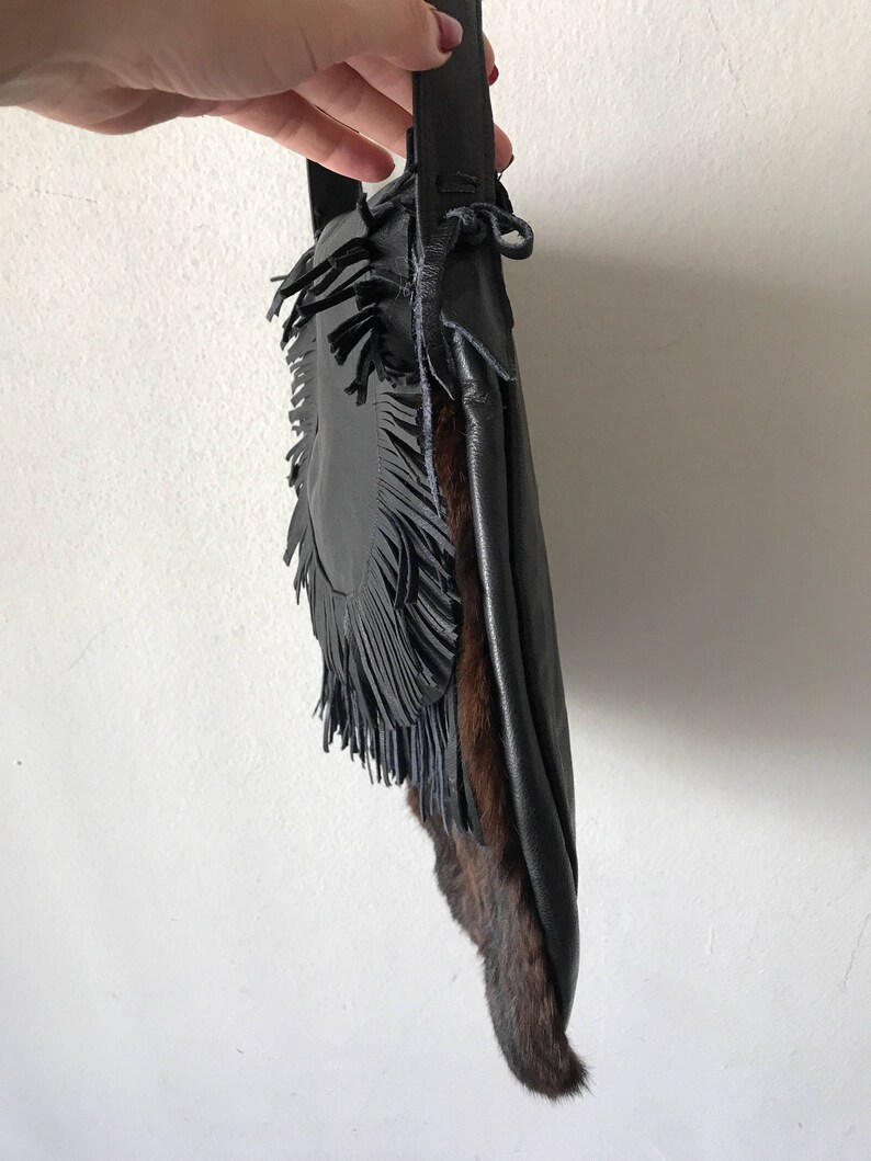 Women/'s dark brown handmade handbag made of leather and rabbit fur on a long handle with fringe and original details made in the USA.