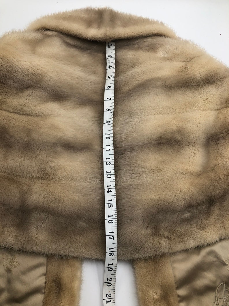 Beige red carpet mink fur bolero.