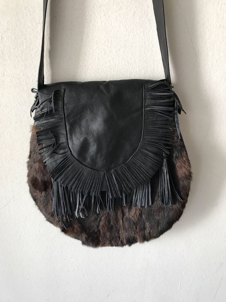 Women/'s dark brown handmade handbag made of leather and rabbit fur on a long handle with fringe and original details made in the USA.