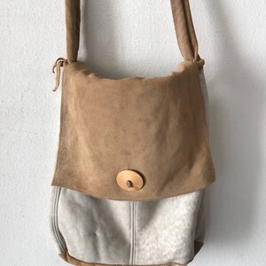 Women&#39;s Handmade handbag made of  sheepskin fur of two colors-brown and beige; on long handle, bag with  original detaile, made in the USA.