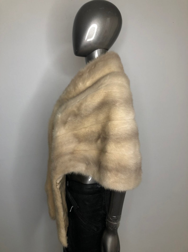 Beige red carpet mink fur bolero.