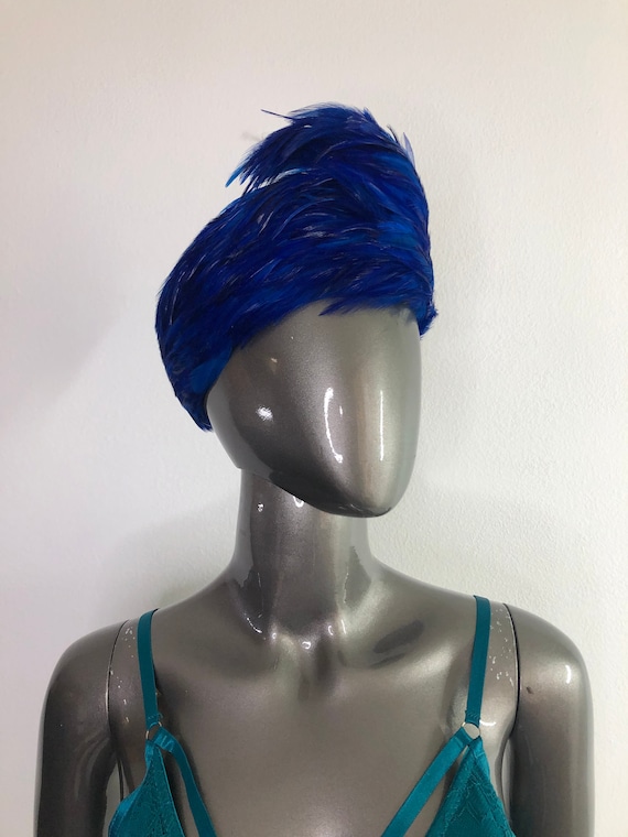 Blue fashion feather hat woman.